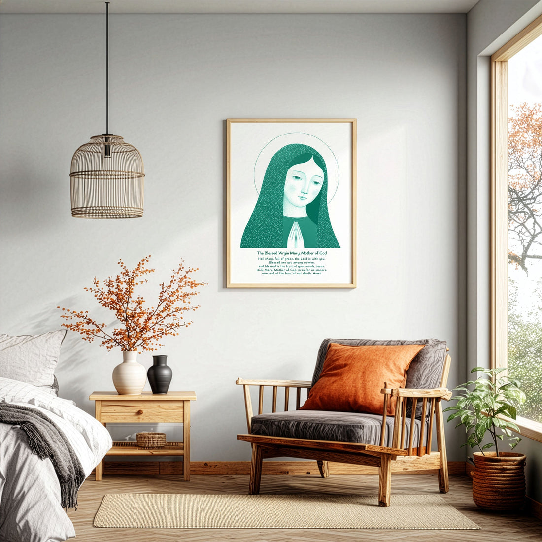 Green Virgin Mary prayer art print displayed beside a wooden chair in a bright room