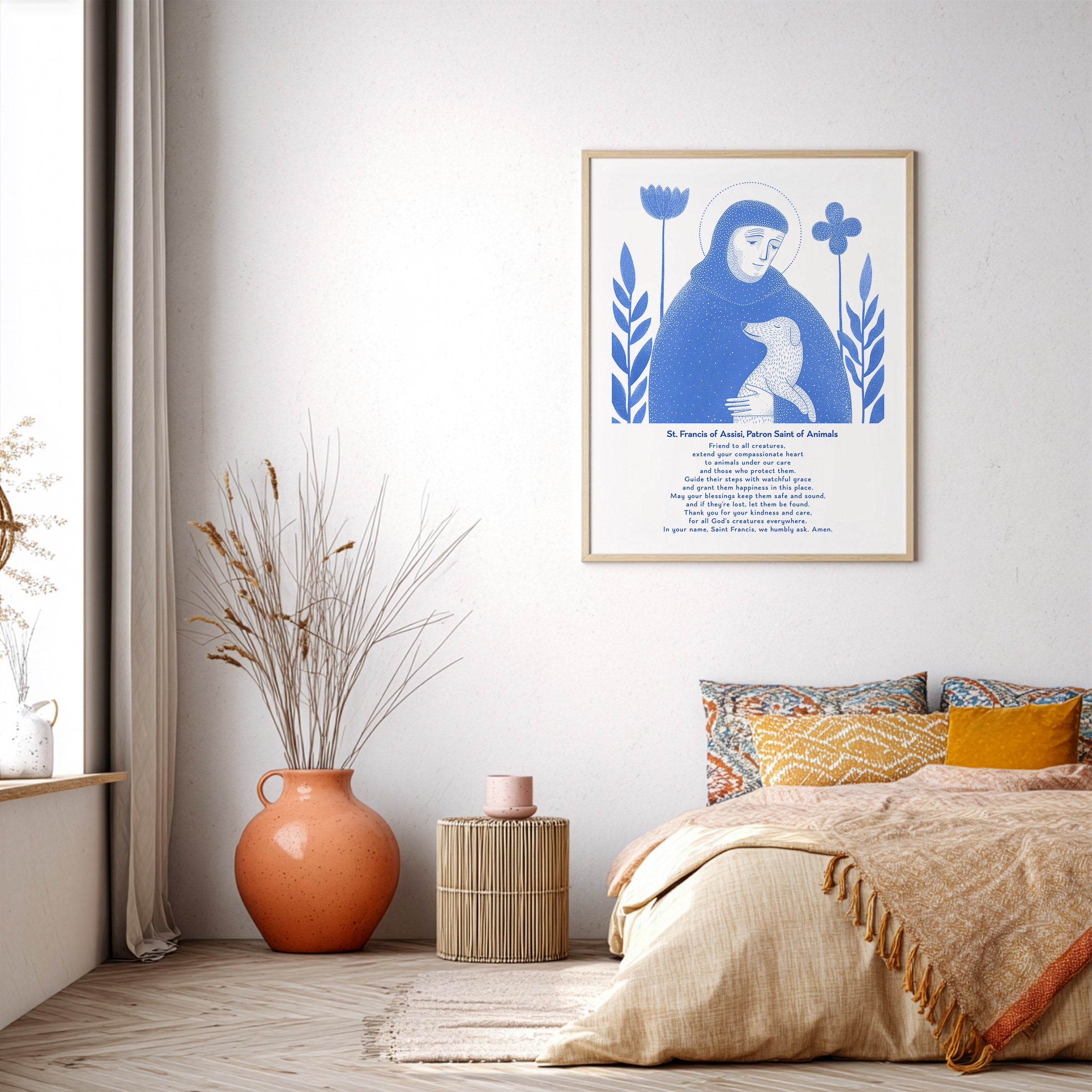 Blue St. Francis of Assisi with dog art print displayed in a bright neutral bedroom