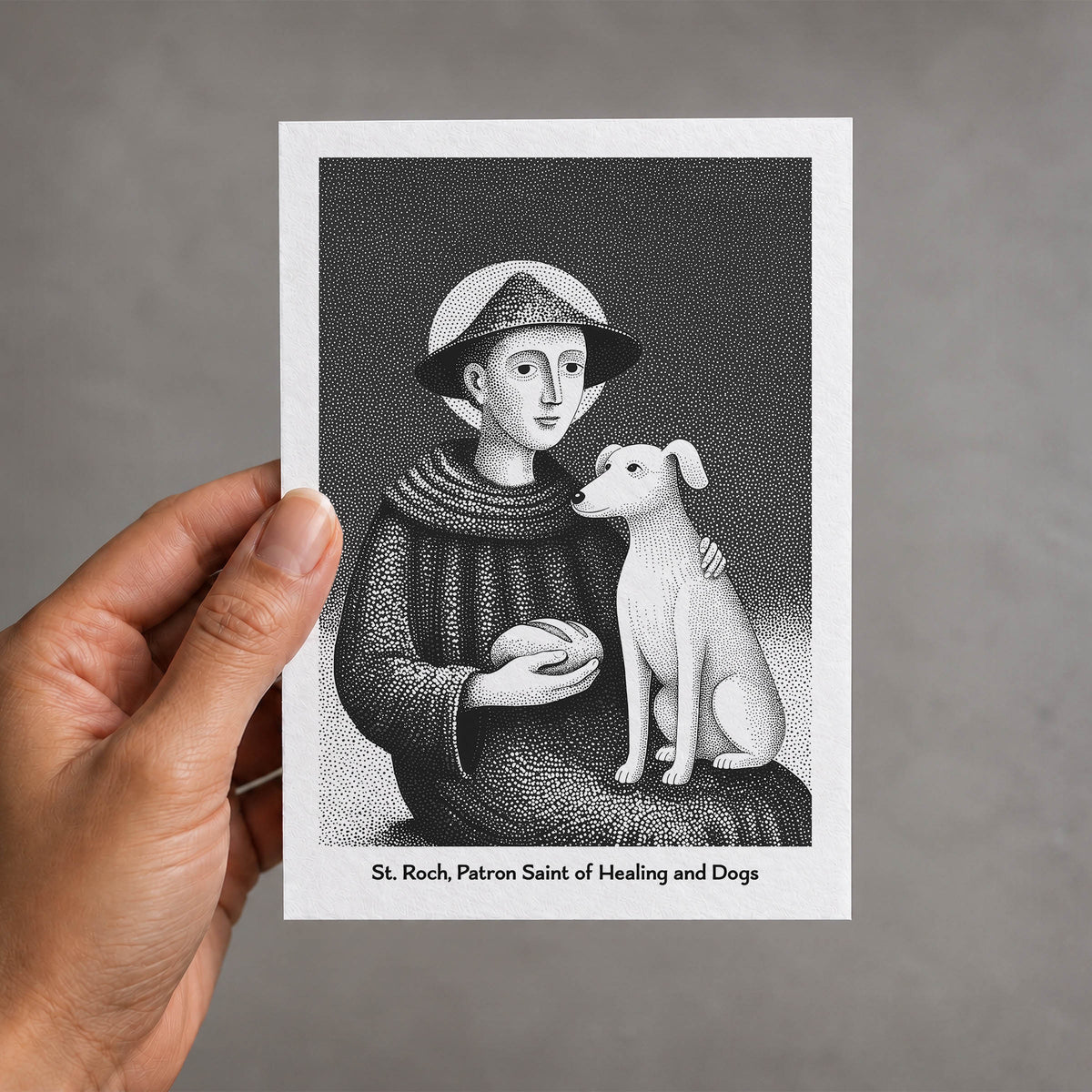 Black St Roch card held in a hand