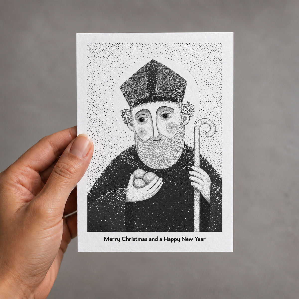 Black St Nicholas of Myra card held in a hand