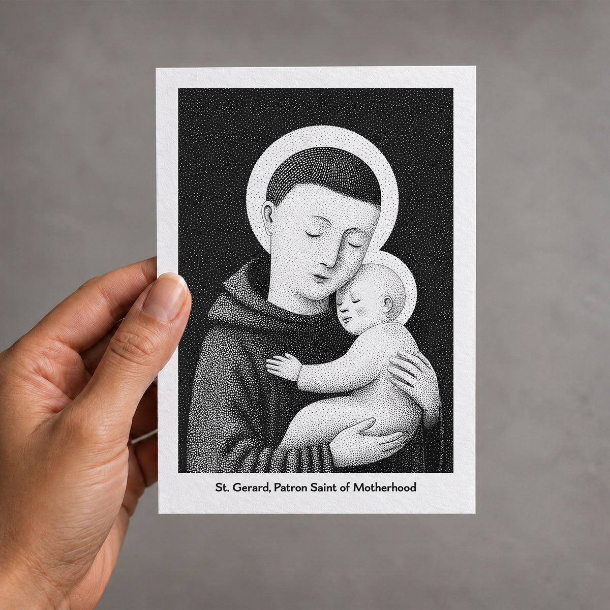 Black St Gerard Majella card held in a hand