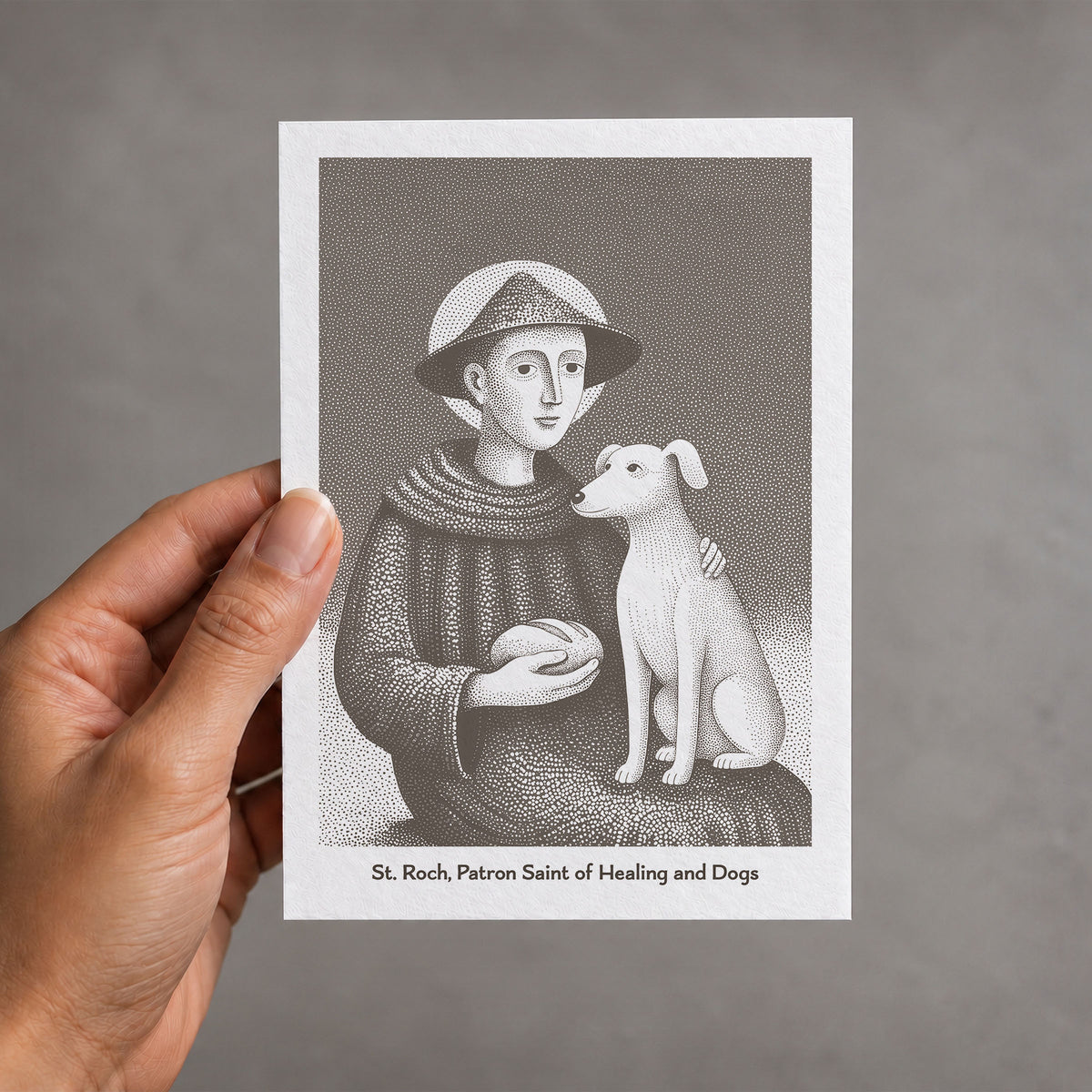 Brown St Roch card held in a hand