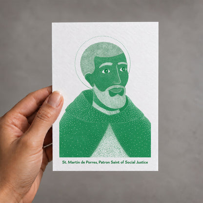 Green St Martin de Porres card held in a hand