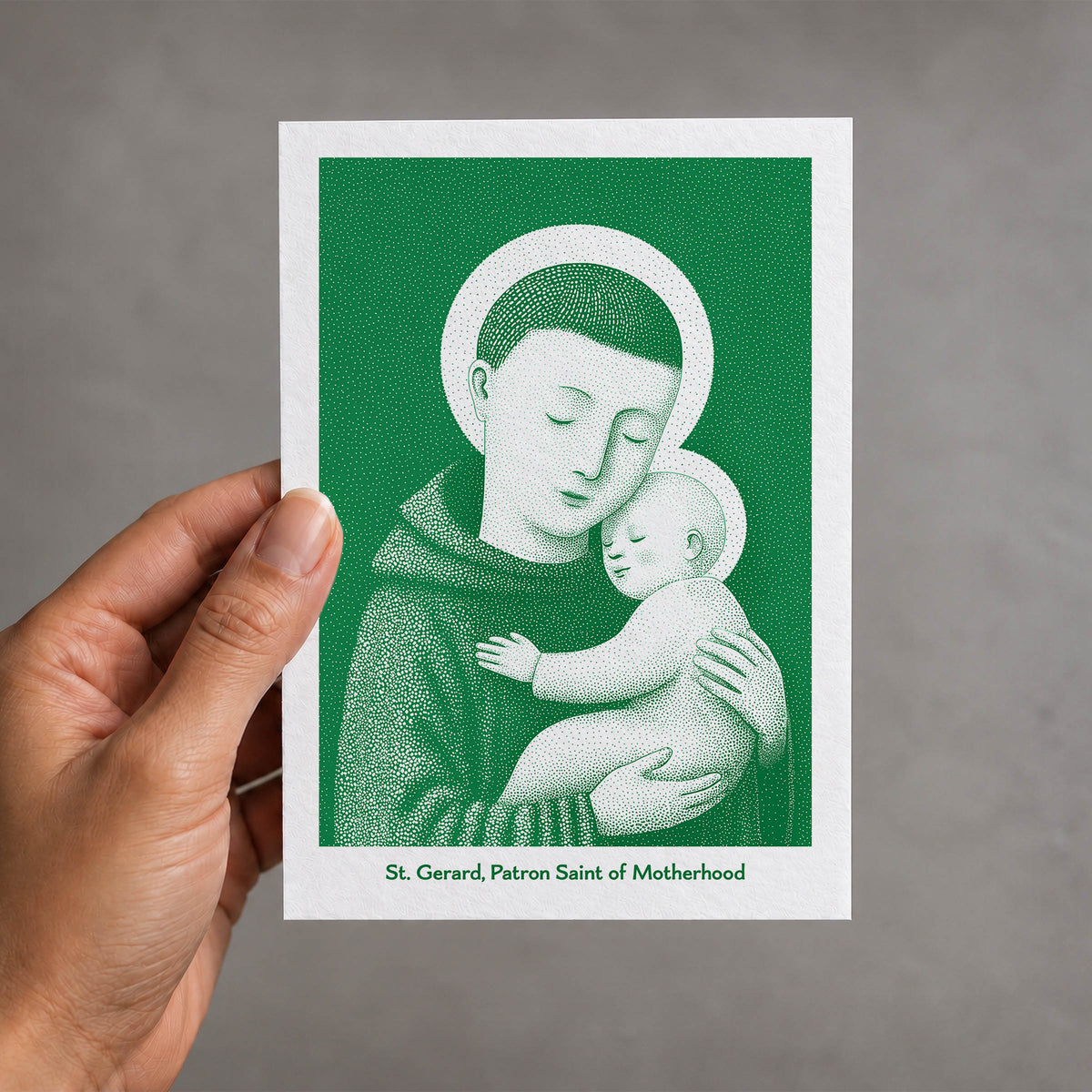 Green St Gerard Majella card held in a hand