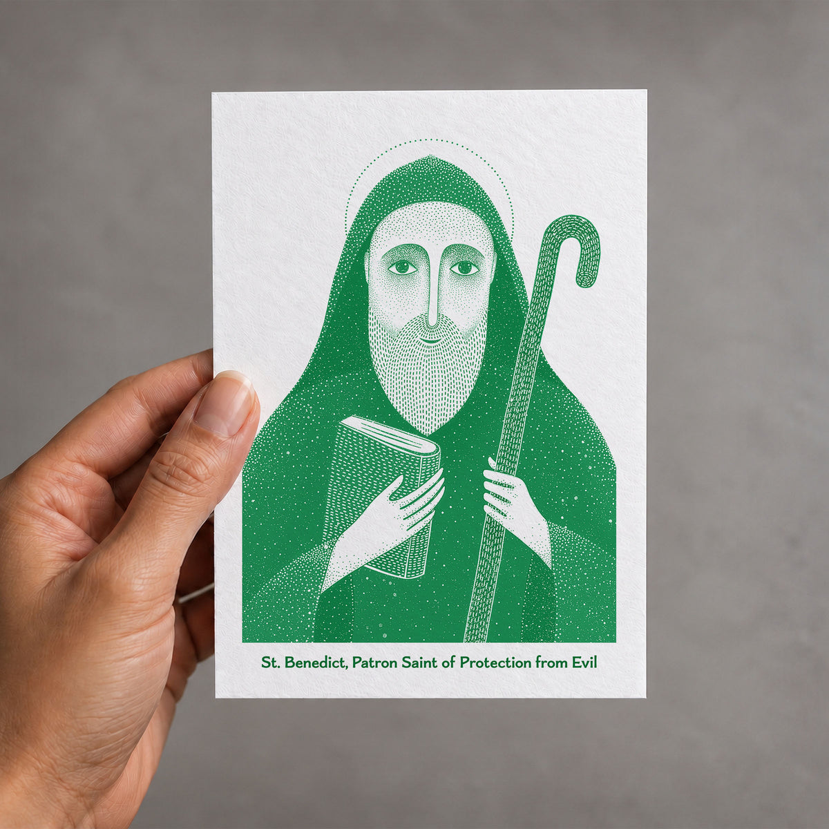 Green St Benedict card held in a hand