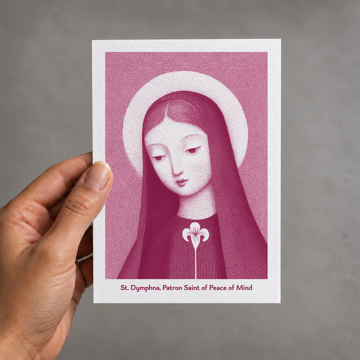 Pink St Dymphna card held in a hand