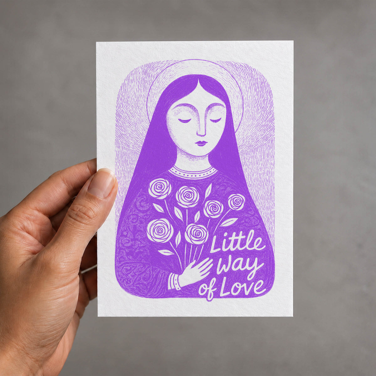 Purple St. Thérèse of Lisieux card held in a hand, Little Way of Love illustration