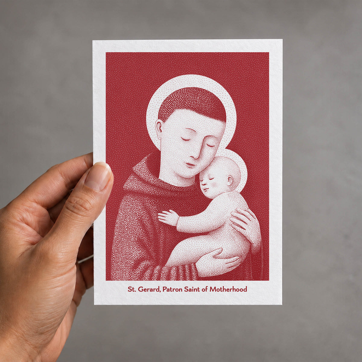 Red St Gerard Majella card held in a hand