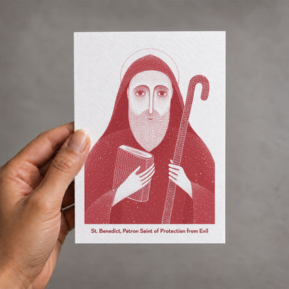 Red St Benedict card held in a hand