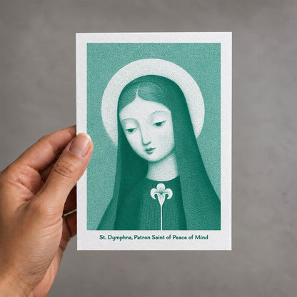Teal St Dymphna card held in a hand