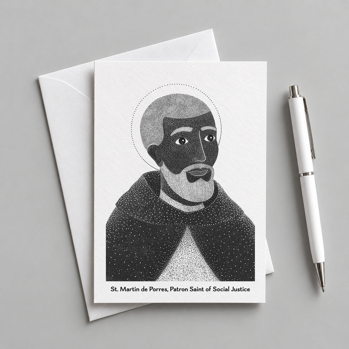 Black St Martin de Porres card with an envelope and pen