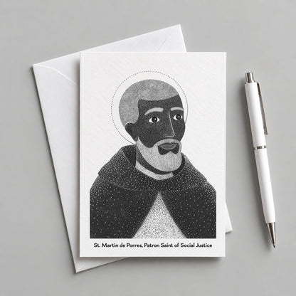 Black St Martin de Porres card with an envelope and pen