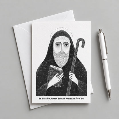 Black St Benedict card with an envelope and pen