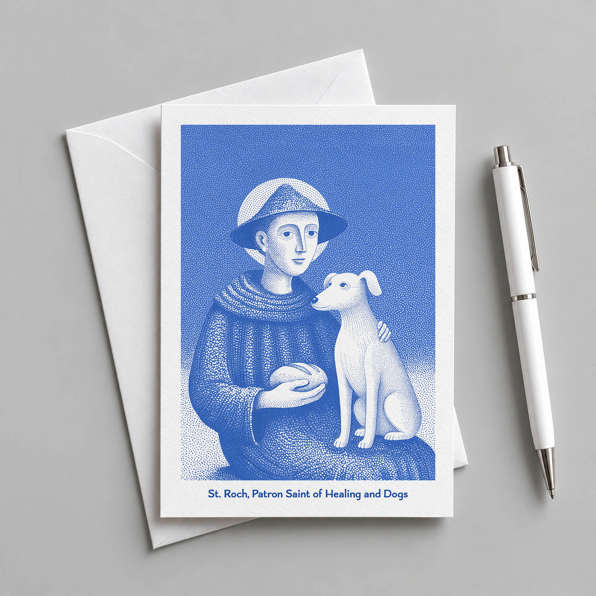Blue St Roch card with an envelope and pen