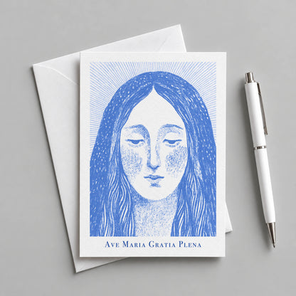 Blue Virgin Mary card with an envelope and pen