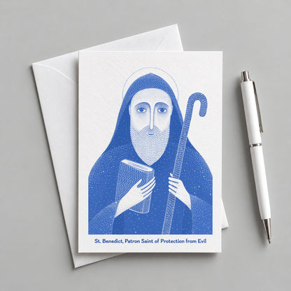 Blue St Benedict card with an envelope and pen