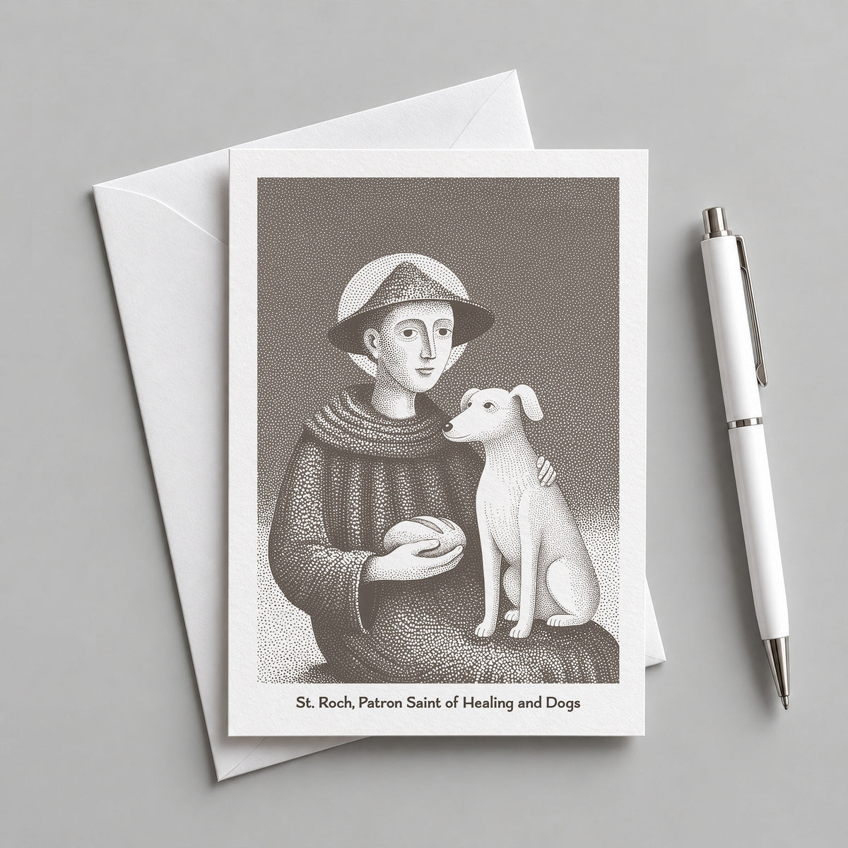 Brown St Roch card with an envelope and pen