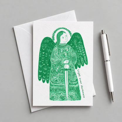 Green St Michael the Archangel card with an envelope and pen