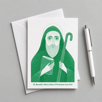 Green St Benedict card with an envelope and pen