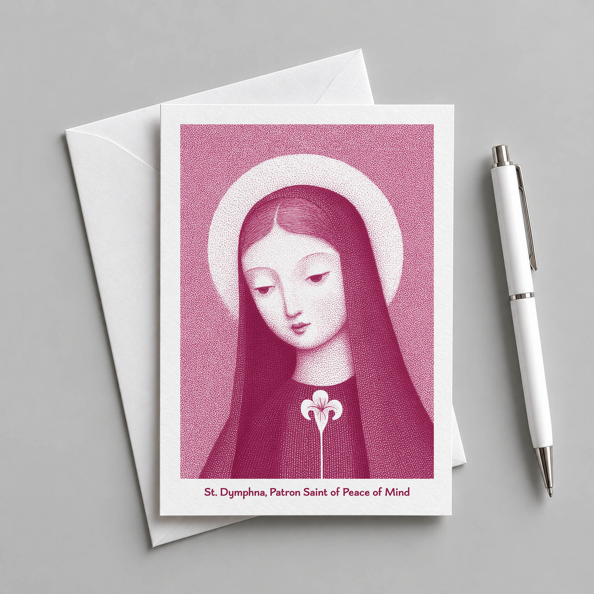Pink St Dymphna card with an envelope and pen