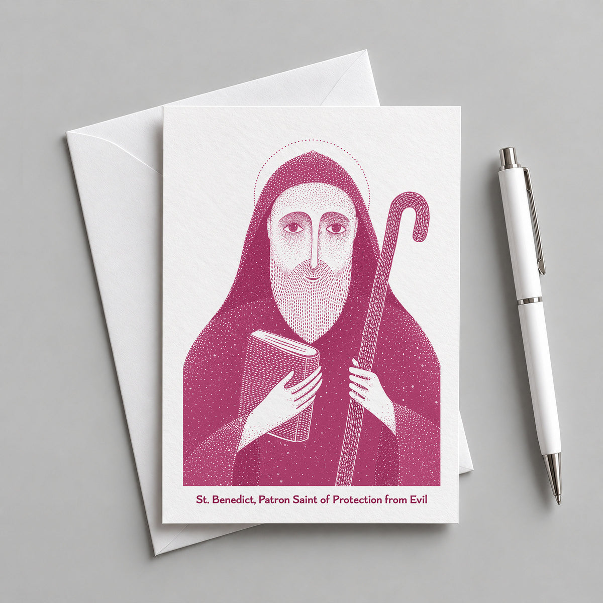 Pink St Benedict card with an envelope and pen
