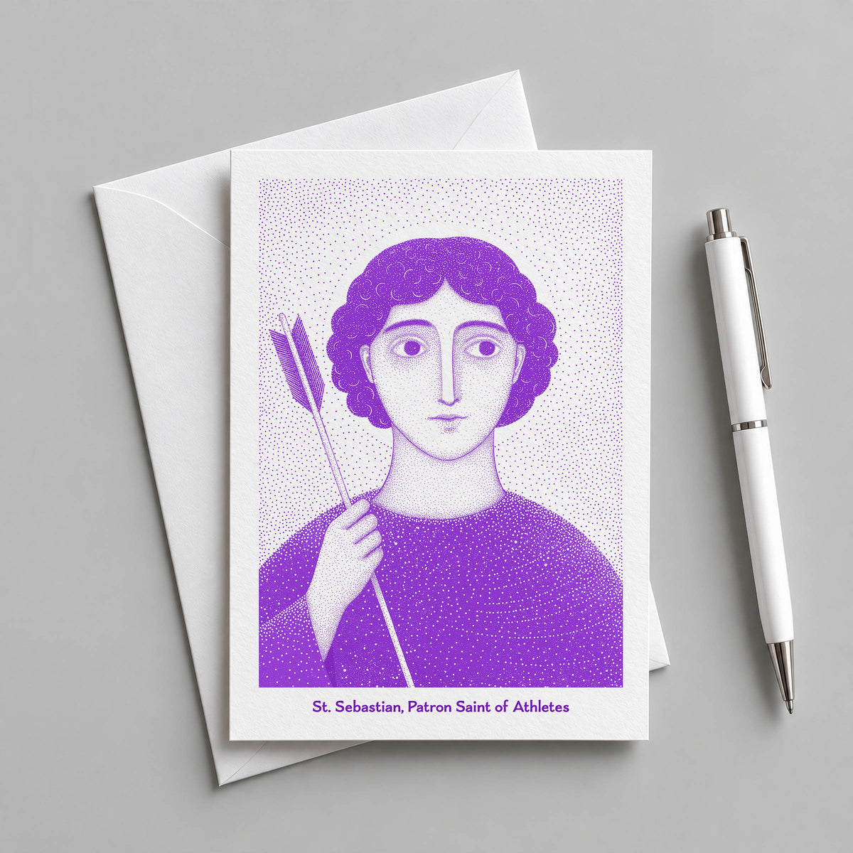 Purple St Sebastian card with an envelope and pen