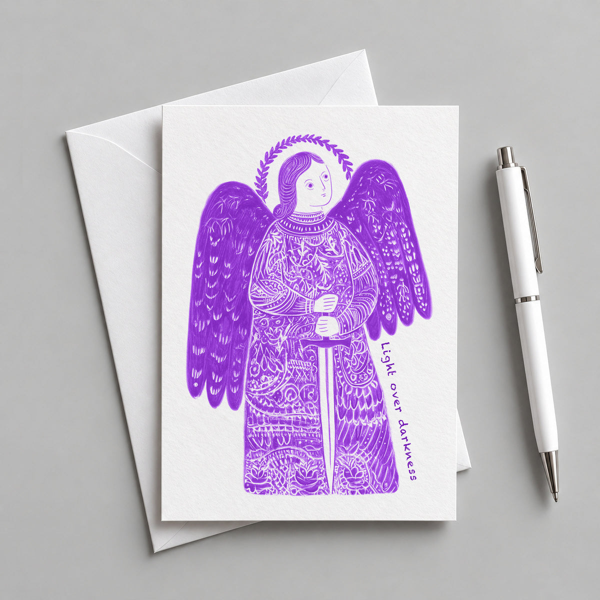 Purple St Michael the Archangel card with an envelope and pen