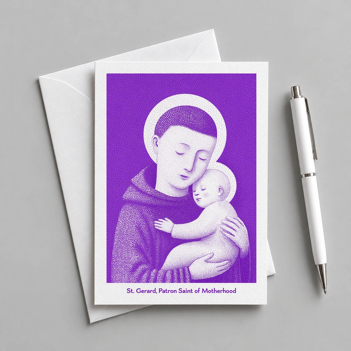 Purple St Gerard Majella card with an envelope and pen