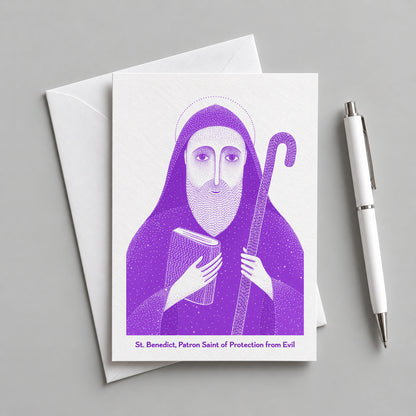 Purple St Benedict card with an envelope and pen