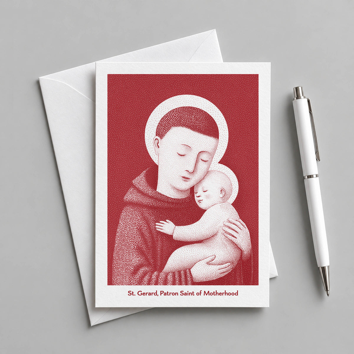 Red St Gerard Majella card with an envelope and pen