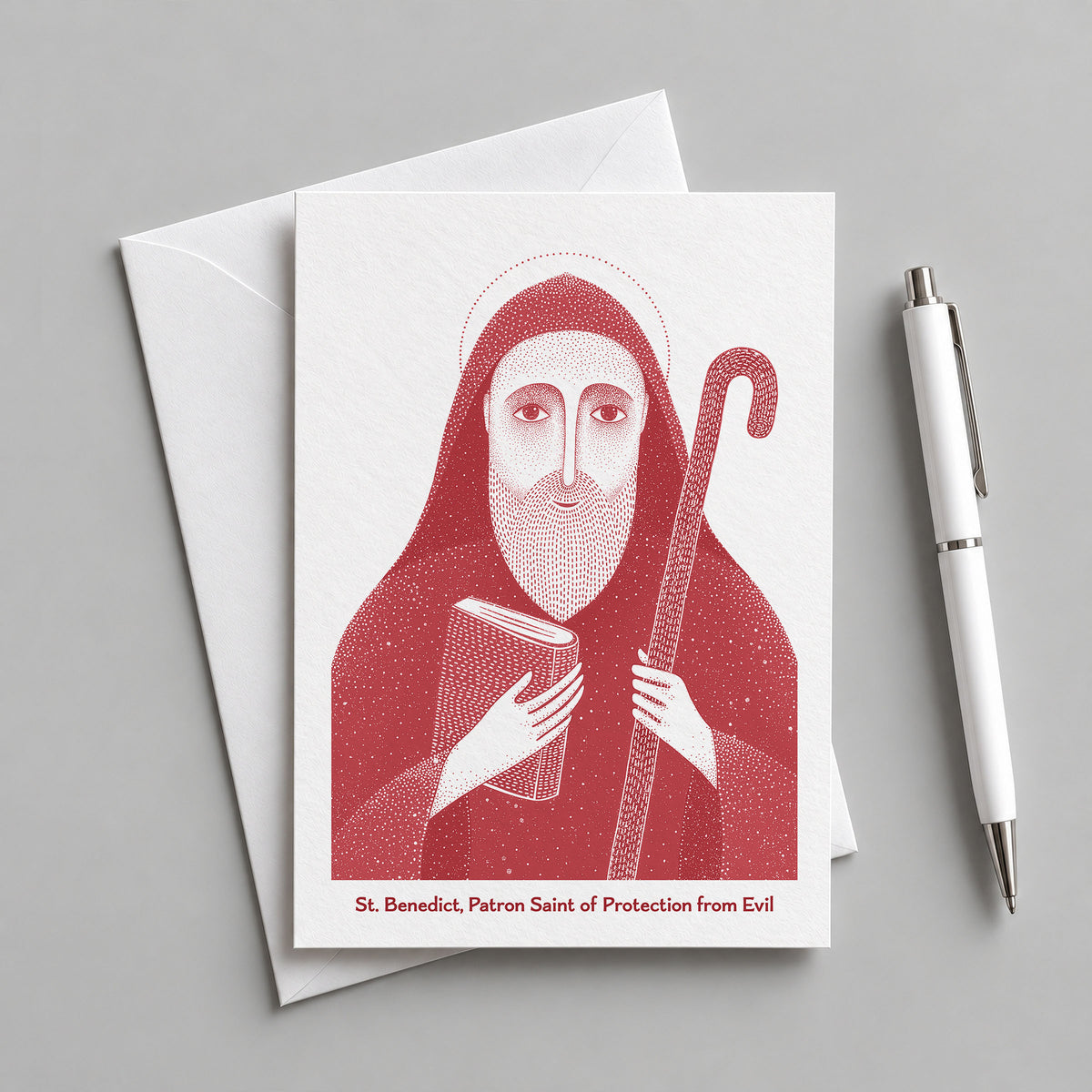 Red St Benedict card with an envelope and pen