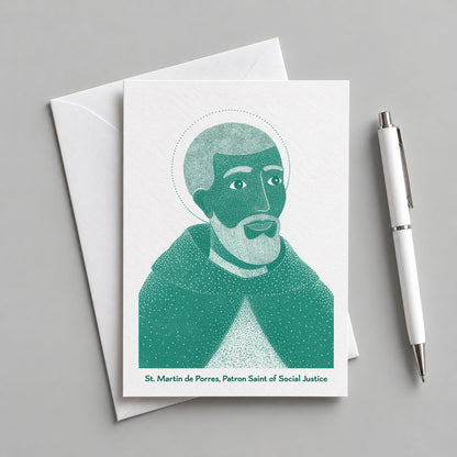 Teal St Martin de Porres card with an envelope and pen