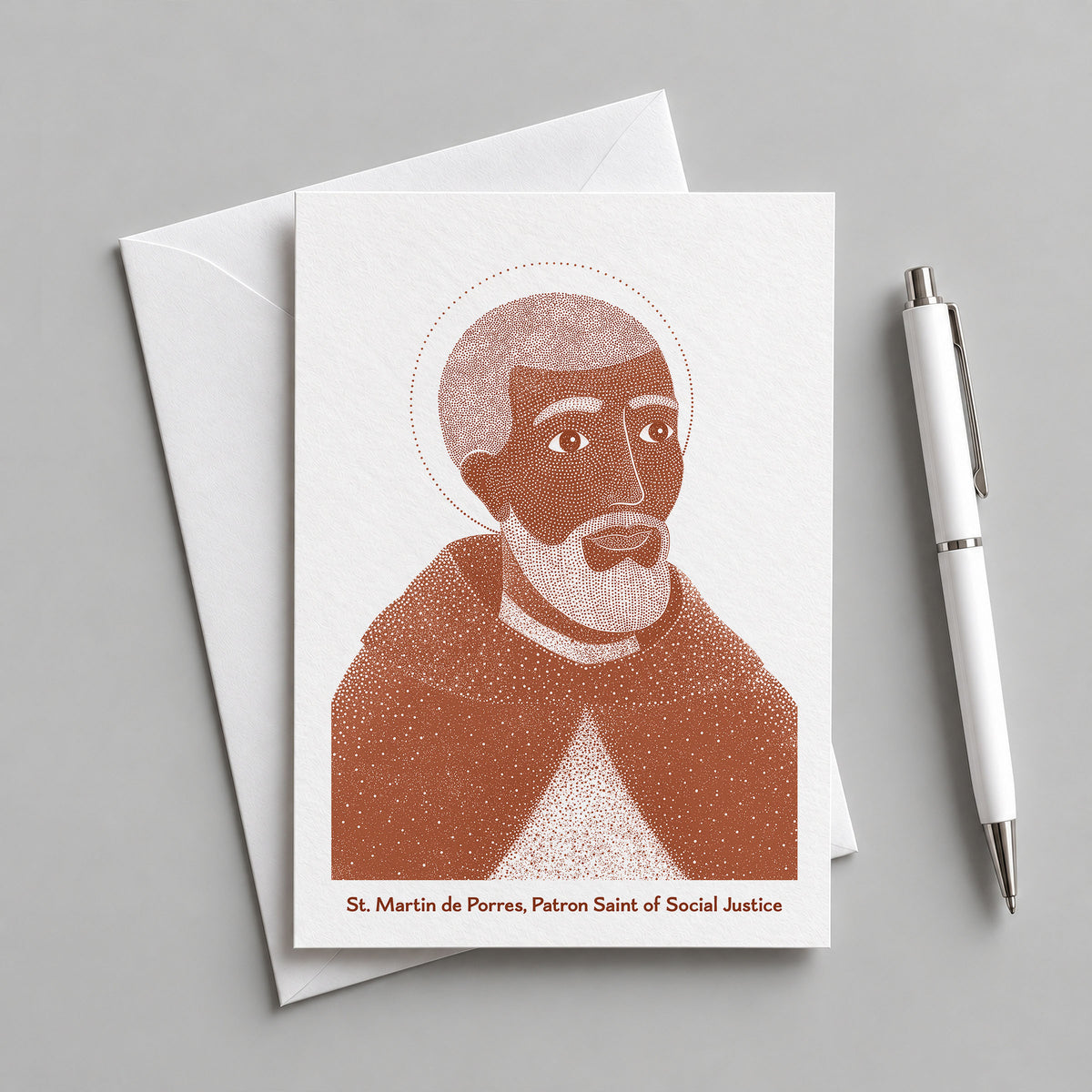 Terracotta St Martin de Porres card with an envelope and pen